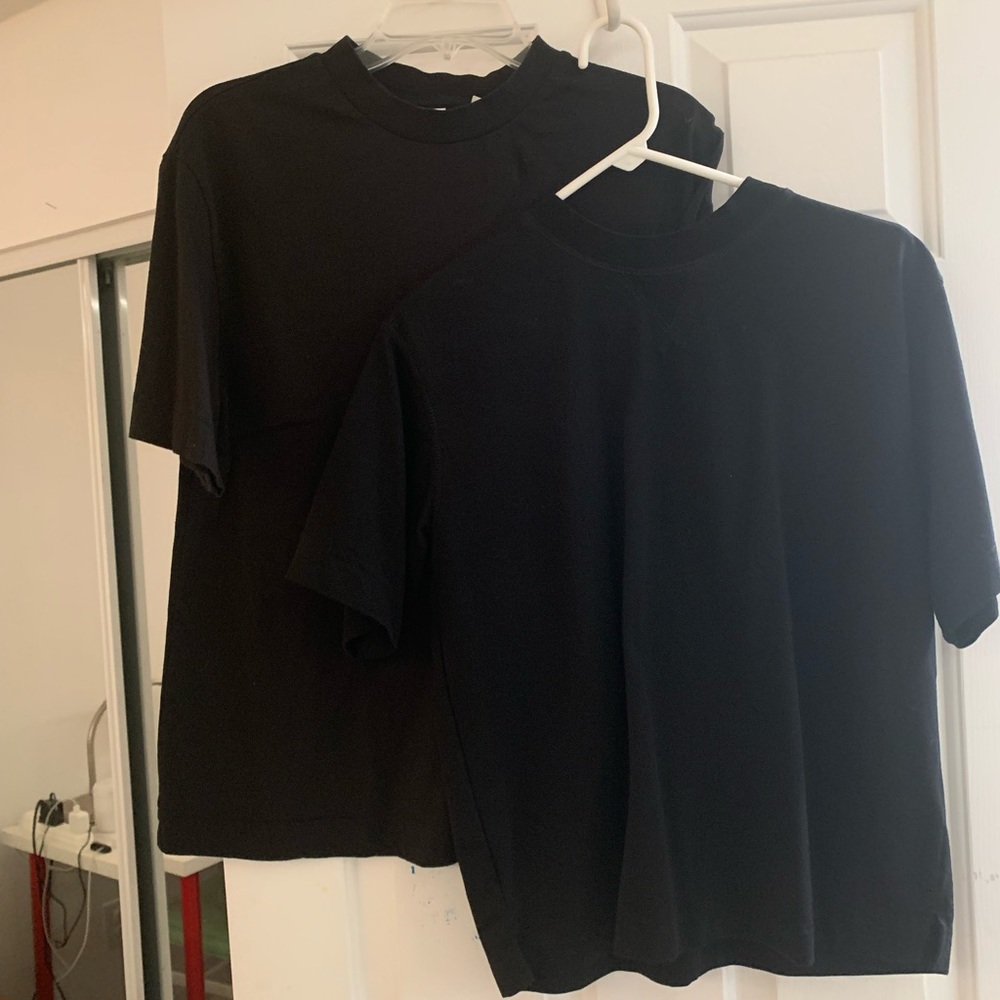 Two black work shirts